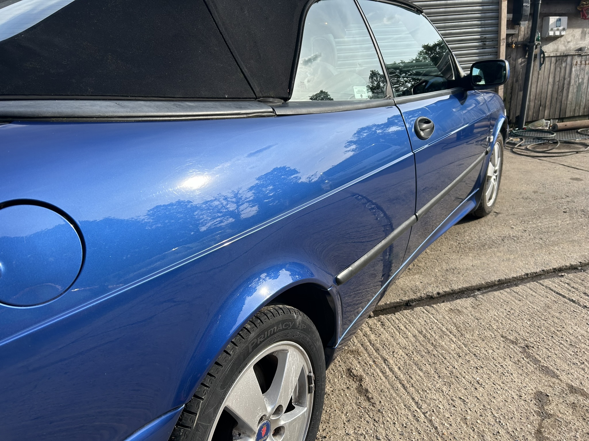 Saab 9-3 Convertible Side Panel Repair: Bringing the Blue Back to Life